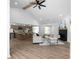 Spacious living room with a fireplace, ceiling fan, and open access to the kitchen area at 7171 Hazelwood Dr, Jonesboro, GA 30236