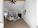 Open-concept living room featuring a fireplace and modern furniture, bathed in natural light at 7171 Hazelwood Dr, Jonesboro, GA 30236
