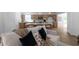 Living area showcasing comfortable seating and access to the kitchen, creating a cozy atmosphere at 7171 Hazelwood Dr, Jonesboro, GA 30236
