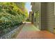 Private patio with lush greenery creating a serene outdoor space at 127 Stoney Creek Pkwy, Woodstock, GA 30188