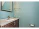 Powder room with a modern vanity and granite countertop at 127 Stoney Creek Pkwy, Woodstock, GA 30188