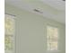 Green-walled bedroom with lots of natural light streaming in from bright windows at 127 Stoney Creek Pkwy, Woodstock, GA 30188