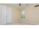 A light filled bedroom with double doors, a window, and carpeted floors at 127 Stoney Creek Pkwy, Woodstock, GA 30188