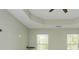 Bright and open bedroom with windows offering natural light and a ceiling fan at 127 Stoney Creek Pkwy, Woodstock, GA 30188