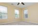 Airy bedroom featuring plush carpeting and natural light streaming in from multiple windows at 127 Stoney Creek Pkwy, Woodstock, GA 30188