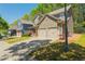 Two-story home with a well-maintained lawn and driveway leading to a two-car garage at 127 Stoney Creek Pkwy, Woodstock, GA 30188