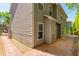 Side view of the two-story home showcasing neutral siding, brick path, and neatly maintained landscaping at 127 Stoney Creek Pkwy, Woodstock, GA 30188