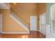 Bright foyer features hardwood floors, tall ceilings, and a staircase leading to the upper level at 127 Stoney Creek Pkwy, Woodstock, GA 30188