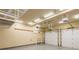 Spacious two car garage with storage racks and modern garage door openers at 127 Stoney Creek Pkwy, Woodstock, GA 30188