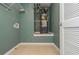 Clean and functional laundry room with modern water heater and tiled floor at 127 Stoney Creek Pkwy, Woodstock, GA 30188