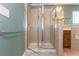 Walk-in tiled shower with glass door and chrome fixtures at 127 Stoney Creek Pkwy, Woodstock, GA 30188