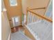 Stairwell with a chandelier, natural wood, and carpeted stairs at 127 Stoney Creek Pkwy, Woodstock, GA 30188
