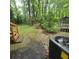 A partial shot of the backyard, with a trampoline and AC unit visible at 1901 Arnold Dr, Austell, GA 30106