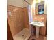 Clean bathroom with step-in shower, pedestal sink, and vanity mirror at 1901 Arnold Dr, Austell, GA 30106