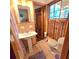 Bathroom featuring a classic pedestal sink, toilet, and patterned tile flooring at 1901 Arnold Dr, Austell, GA 30106