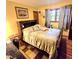Comfortable bedroom features a plush bed, yellow walls and natural light at 1901 Arnold Dr, Austell, GA 30106