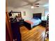 This bedroom features neutral walls and flooring, a ceiling fan and a large bedroom set at 1901 Arnold Dr, Austell, GA 30106