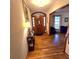 Warm and inviting foyer featuring hardwood floors and a beautiful wood front door at 1901 Arnold Dr, Austell, GA 30106