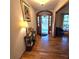 Inviting foyer with hardwood floors, decorative lighting, and a charming front door at 1901 Arnold Dr, Austell, GA 30106