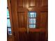 Close-up of a classic wood front door with charming details and a peek-through window at 1901 Arnold Dr, Austell, GA 30106