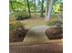 Covered front porch with mosaic tile flooring, leading to a landscaped walkway at 1901 Arnold Dr, Austell, GA 30106