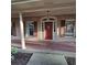 Inviting front porch with brick flooring, classic columns, and a warm, inviting ambiance at 1901 Arnold Dr, Austell, GA 30106