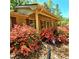Charming brick home featuring colorful azaleas, manicured lawn, and a welcoming entrance at 1901 Arnold Dr, Austell, GA 30106