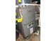 Efficient Lennox furnace ensures reliable heating for the home, placed on a metal platform at 1901 Arnold Dr, Austell, GA 30106