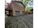 View of a two car garage and expansive driveway, offering convenience and ample parking for residents and guests at 1901 Arnold Dr, Austell, GA 30106
