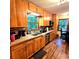 Bright, updated kitchen with extensive wooden cabinetry and stainless steel appliances, enhancing the home's appeal at 1901 Arnold Dr, Austell, GA 30106