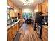 Well-appointed kitchen with wooden cabinets and stainless steel appliances, designed for culinary enthusiasts at 1901 Arnold Dr, Austell, GA 30106