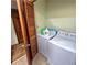 Functional laundry area equipped with modern appliances and tile flooring at 1901 Arnold Dr, Austell, GA 30106