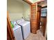 Convenient laundry area features tile flooring and modern washer and dryer at 1901 Arnold Dr, Austell, GA 30106