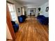 Spacious living room featuring gleaming hardwood floors and elegant blue seating, ideal for gatherings at 1901 Arnold Dr, Austell, GA 30106