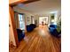 Bright living room with hardwood floors and modern blue furniture, perfect for relaxation and entertaining at 1901 Arnold Dr, Austell, GA 30106