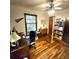 Well-lit home office featuring hardwood floors, natural light, and ceiling fan at 1901 Arnold Dr, Austell, GA 30106