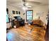 Home office space features hardwood floors, natural light and is complete with wooden desk and shelving at 1901 Arnold Dr, Austell, GA 30106