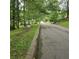 Street view with signage near a beautiful, tree-lined property at 1901 Arnold Dr, Austell, GA 30106