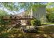 Expansive backyard featuring a multi-level deck, stone patio, and mature landscaping at 350 Covered Bridge Sw Pl, Smyrna, GA 30082