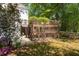 Multi-tiered deck overlooking a lush backyard with mature trees, offering privacy and outdoor living space at 350 Covered Bridge Sw Pl, Smyrna, GA 30082