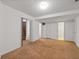 Spacious finished basement with neutral carpeting, white walls, and multiple doorways at 350 Covered Bridge Sw Pl, Smyrna, GA 30082
