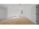 A bright bedroom with carpet and a large window showing the natural outdoor light at 350 Covered Bridge Sw Pl, Smyrna, GA 30082