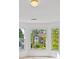 A bright room with large windows overlooking the exterior of the home at 350 Covered Bridge Sw Pl, Smyrna, GA 30082