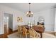 Inviting dining room with hardwood floors, chandelier, and decorative molding at 350 Covered Bridge Sw Pl, Smyrna, GA 30082