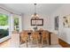 A lovely dining room featuring hardwood floors, crown molding, and natural light at 350 Covered Bridge Sw Pl, Smyrna, GA 30082