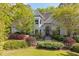 Charming traditional home featuring a manicured lawn and mature landscaping at 350 Covered Bridge Sw Pl, Smyrna, GA 30082
