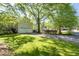 A spacious garage with an extended driveway and a lush green yard at 350 Covered Bridge Sw Pl, Smyrna, GA 30082