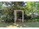 Charming garden with an arbor, lush greenery, and a serene atmosphere for relaxation at 350 Covered Bridge Sw Pl, Smyrna, GA 30082