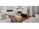 Bright living room featuring a fireplace, stylish furniture, and hardwood floors at 350 Covered Bridge Sw Pl, Smyrna, GA 30082