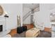 Living area features a fireplace, staircase, and hardwood floors at 350 Covered Bridge Sw Pl, Smyrna, GA 30082